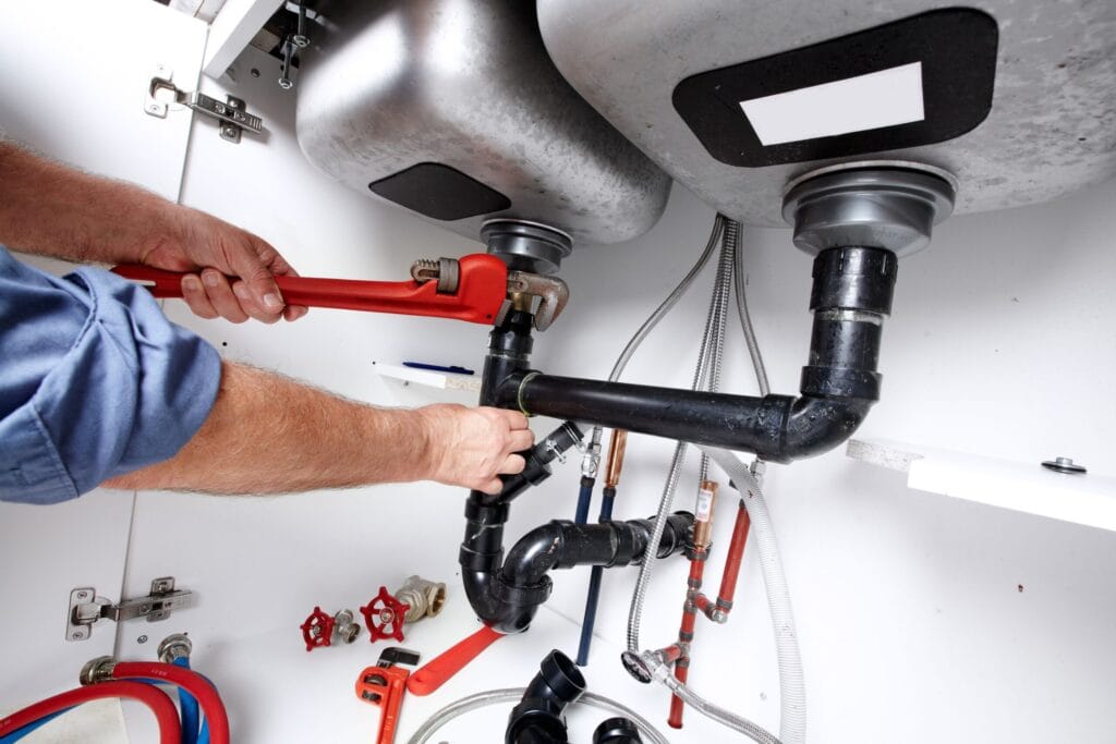 Rome Plumbing Pros fixing under sink plumbing and drain pipes
